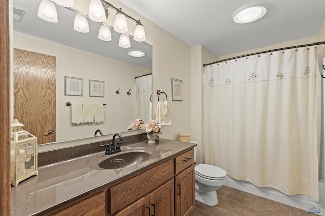 full bathroom featuring vanity, shower / tub combo with curtain, tile patterned floors, and toilet