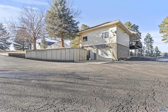 view of side of property featuring a garage