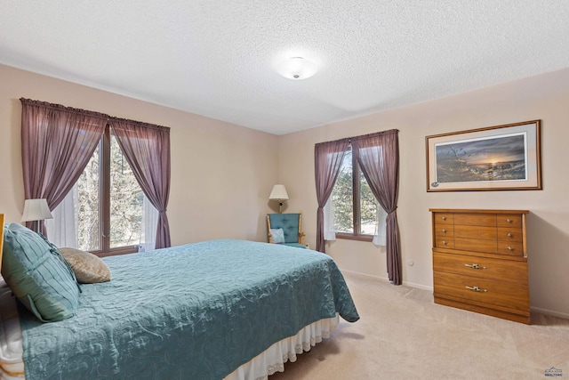 carpeted bedroom featuring a textured ceiling