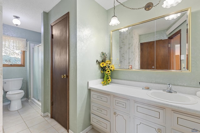 bathroom featuring an enclosed shower, vanity, tile patterned floors, and a textured ceiling