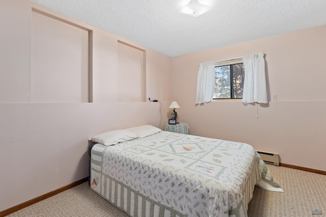 carpeted bedroom with a baseboard radiator and a textured ceiling