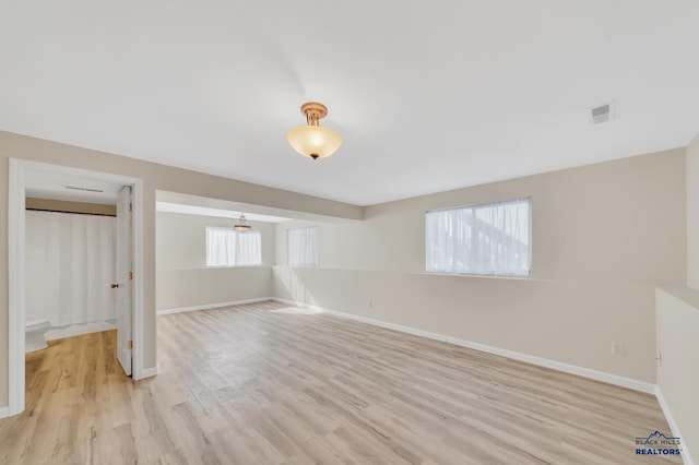 unfurnished room with light hardwood / wood-style flooring