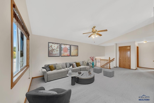 carpeted living room featuring lofted ceiling and ceiling fan