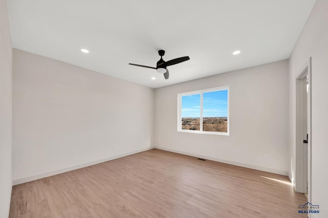 unfurnished room with light hardwood / wood-style floors and ceiling fan