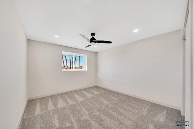 unfurnished room featuring ceiling fan and carpet flooring