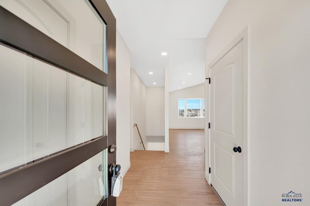 corridor featuring light hardwood / wood-style floors