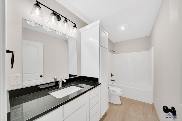 full bathroom featuring vanity, toilet, and bathing tub / shower combination