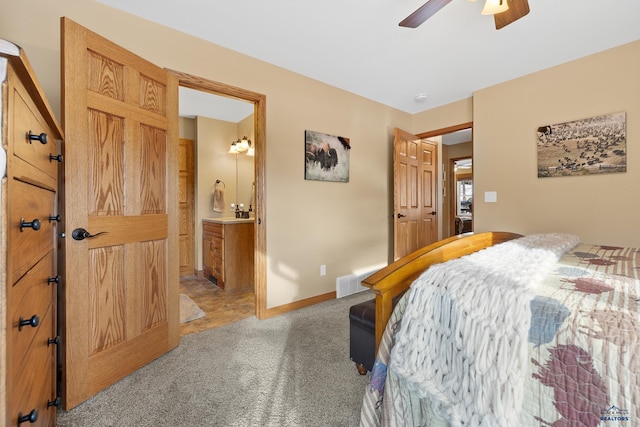 369 Deegan Dr, Hill City, SD 57745 - bedroom with ensuite bathroom, light colored carpet, and ceiling fan