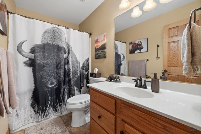 369 Deegan Dr, Hill City, SD 57745 - bathroom featuring vanity, tile patterned flooring, and toilet