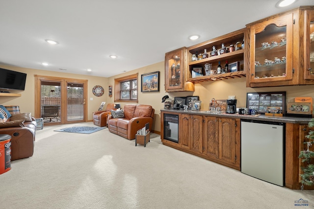 369 Deegan Dr, Hill City, SD 57745 - bar with stainless steel refrigerator, sink, light carpet, and wine cooler