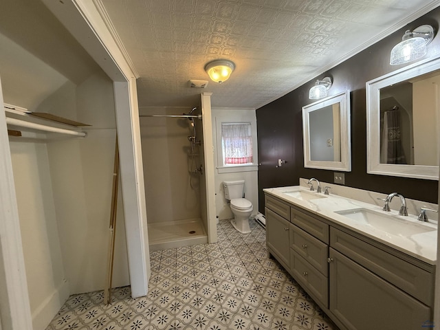 bathroom featuring vanity, toilet, and walk in shower