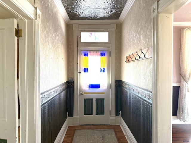 entryway featuring crown molding and wood-type flooring