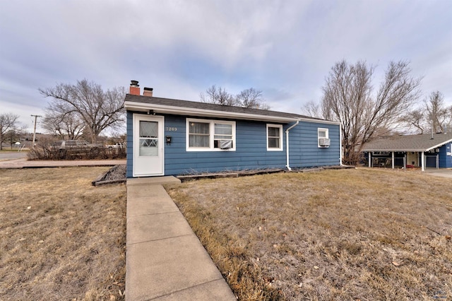 single story home with a front yard