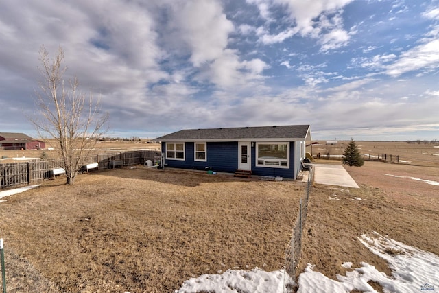 single story home with a rural view