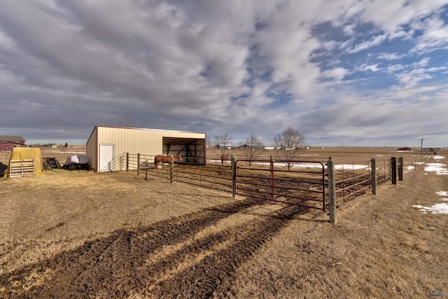 view of horse barn featuring a rural view