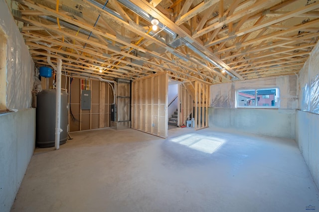 basement featuring gas water heater and electric panel