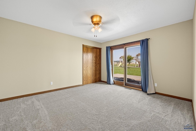 spare room with light colored carpet and ceiling fan