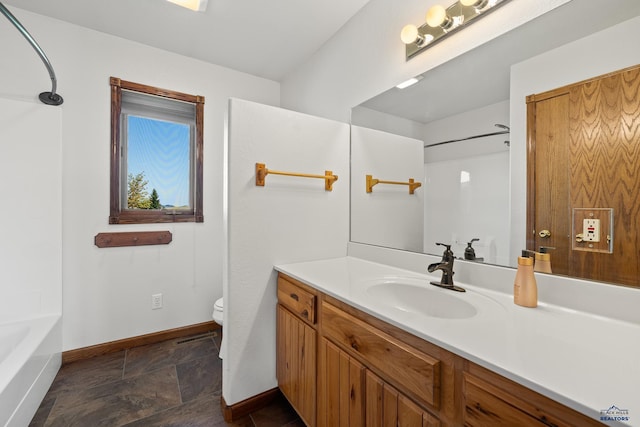 full bathroom featuring vanity,  shower combination, and toilet