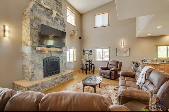 living room featuring a stone fireplace, carpet floors, and high vaulted ceiling