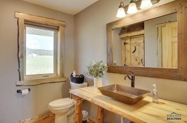 bathroom featuring sink and toilet