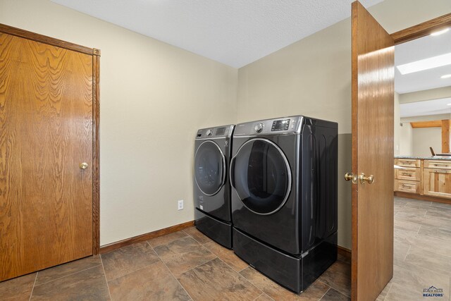 washroom with washing machine and dryer