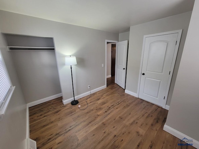 unfurnished bedroom featuring wood-type flooring