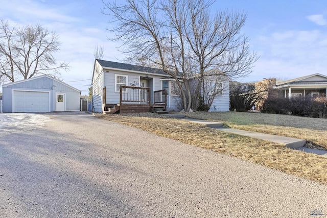 view of front of house featuring a garage and an outdoor structure