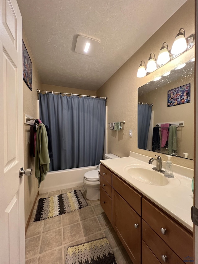 full bathroom with vanity, shower / bathtub combination with curtain, a textured ceiling, and toilet