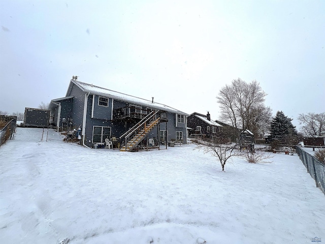 view of snow covered house