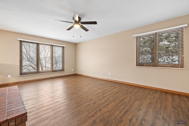 unfurnished room with wood-type flooring, ceiling fan, and a textured ceiling