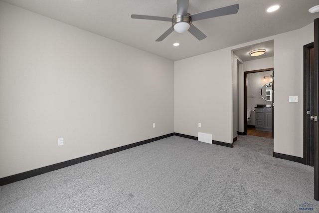 unfurnished bedroom featuring ceiling fan and carpet