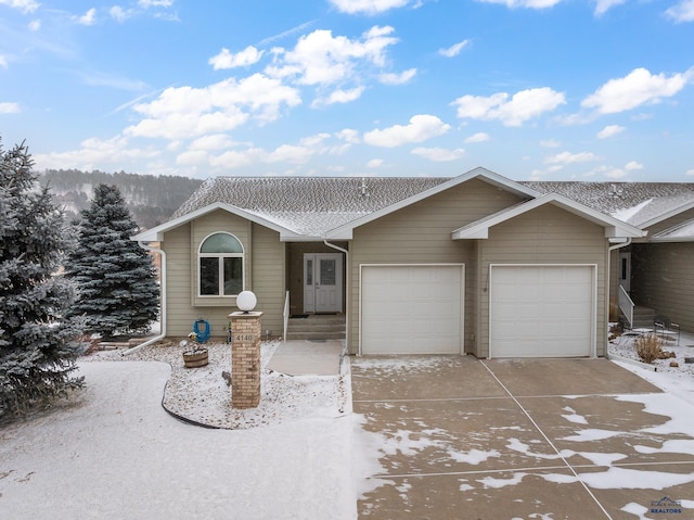 single story home featuring a garage