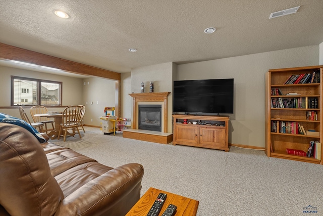 living room featuring carpet flooring and a textured ceiling