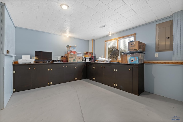 kitchen with dark brown cabinets and electric panel