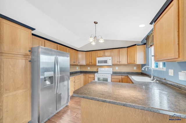 kitchen with sink, vaulted ceiling, light hardwood / wood-style flooring, pendant lighting, and white appliances