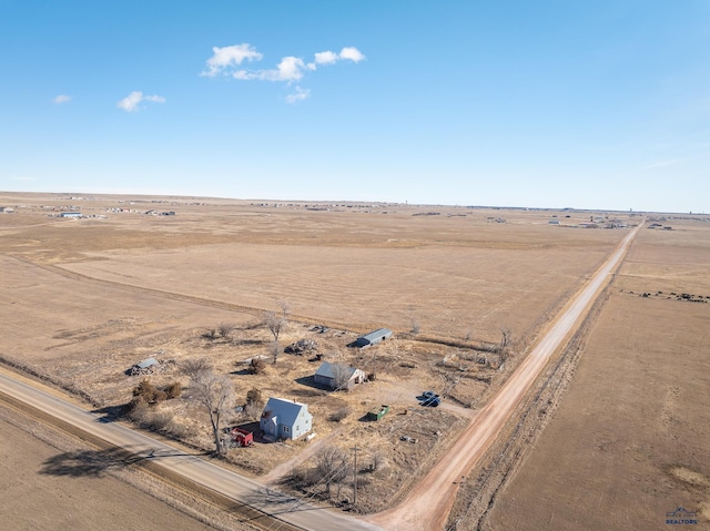 birds eye view of property with a rural view