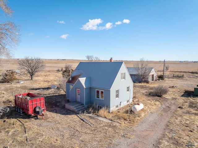 view of side of property featuring a rural view