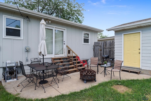 view of patio featuring a grill and a fire pit