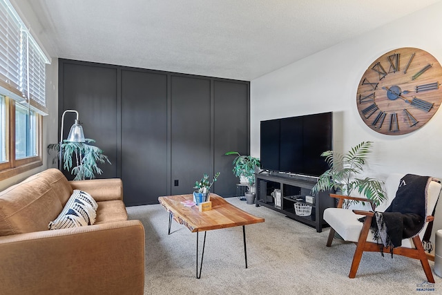 living room with light carpet and a textured ceiling