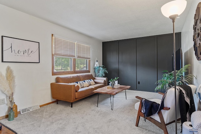 living room featuring light carpet