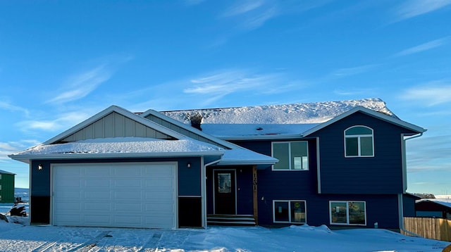 view of front of house featuring a garage and a mountain view