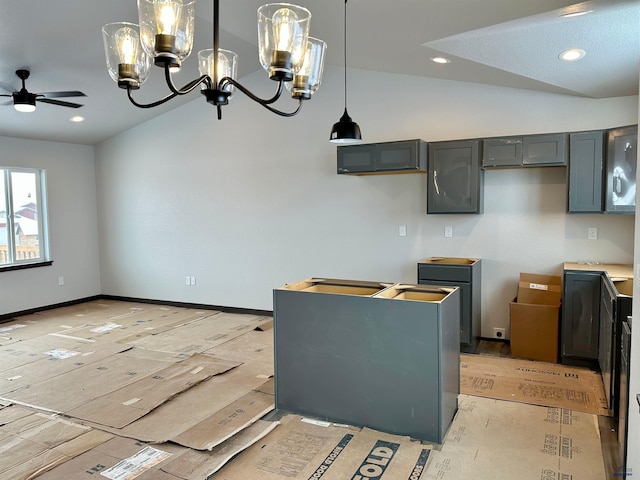 kitchen featuring ceiling fan, vaulted ceiling, hanging light fixtures, and gray cabinetry