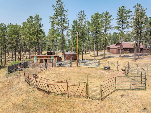 view of yard featuring an outbuilding and a rural view