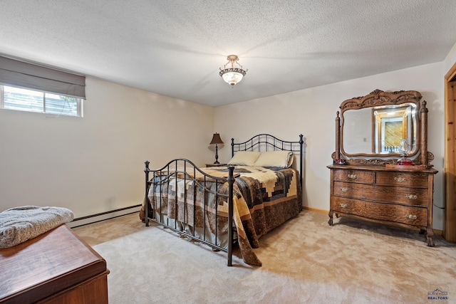 carpeted bedroom with a baseboard heating unit and a textured ceiling