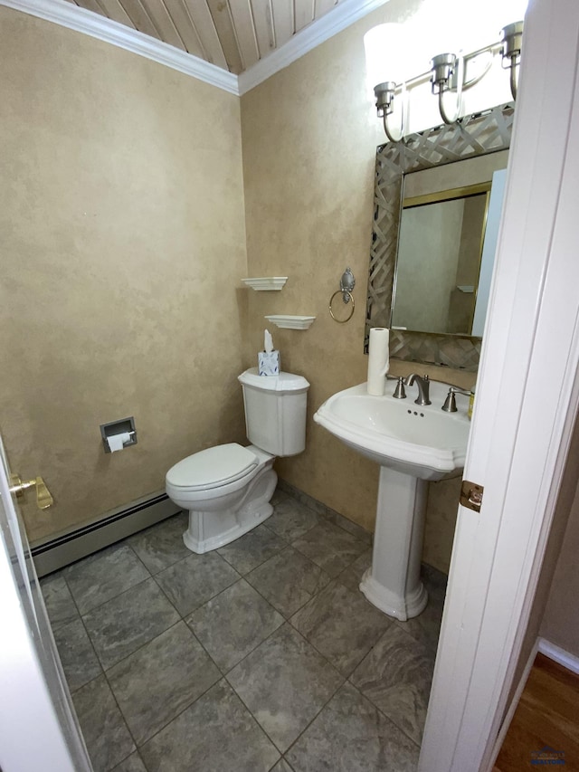 bathroom with ornamental molding, toilet, tile patterned flooring, and a baseboard heating unit