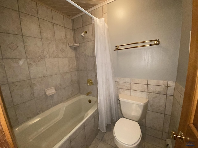 bathroom with toilet, shower / tub combo, and tile walls