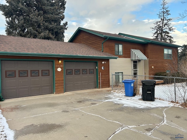 view of side of home featuring a garage