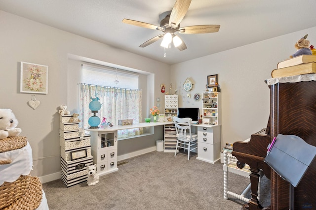 home office featuring ceiling fan and carpet