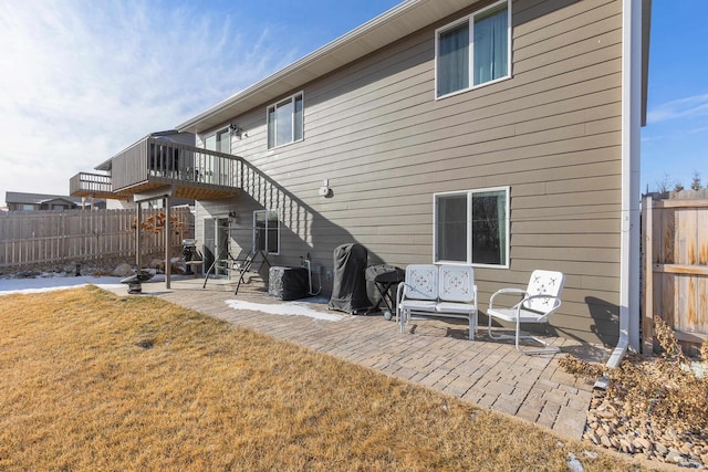 back of house with a yard and a patio area