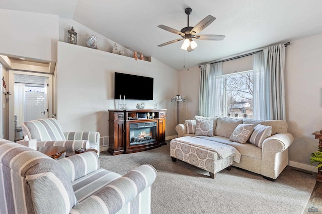 living room featuring vaulted ceiling, ceiling fan, and carpet floors